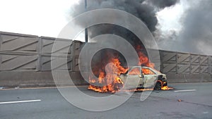 Car on fire accident street