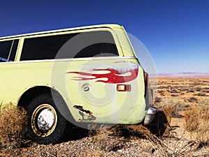 Car with Flames Parked in Desert