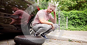 Car With Flat Tire. Man Calling