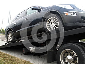 Car on a flatbed truck