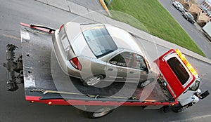 Car on a flatbed truck