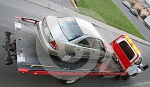 Car on a flatbed truck photo