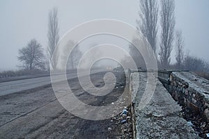 Car in fog with headlights