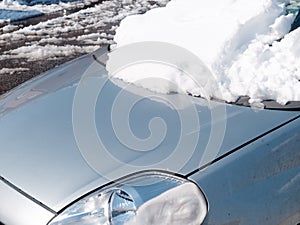 Car frontal window covered fresh snow