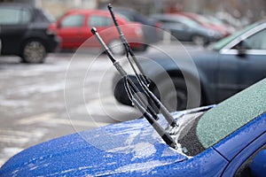 Car frozen windscreen and windscreen wipers after freezing rain