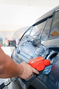 Car fueling at gas station. Refuel fill up with petrol gasoline