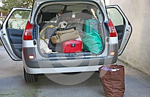 Car full of luggage before departure photo