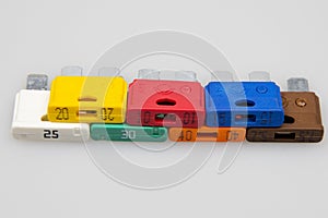 Car fuse of different amperes and colors.