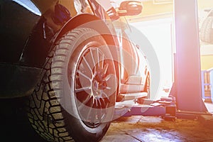 Car in garage of auto repair service with special repairing