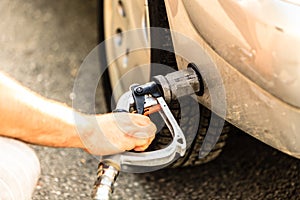 Car at gas station being filled with fuel