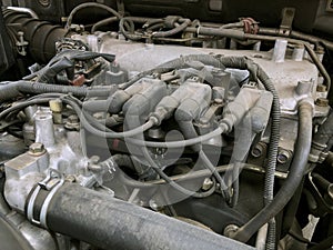 Car gasoline engine photo. Car engine parts. Close-up image, internal combustion engine, used car,