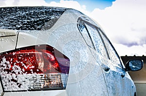 Car getting a wash with soap