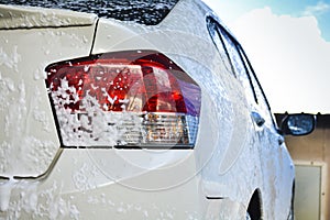 Car getting a wash with soap