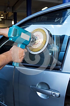 Car Glass polishing with power buffer machine photo