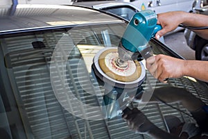 Car Glass polishing with power buffer machine photo