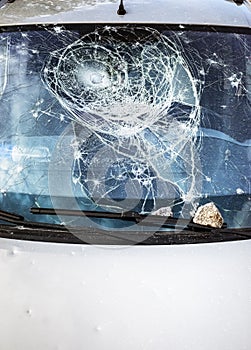 Car glass shattered by a stone