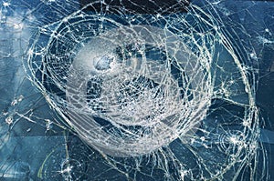 Car glass shattered by a stone