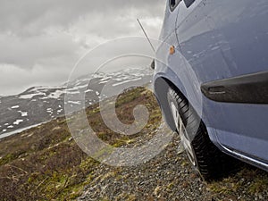 By car into the gloomy landscape of Norway`s mountains