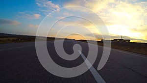 Car goes on highway and view of a passing train