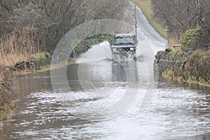Car Going Through Flood