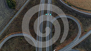 Car gps tracking highway offramp aerial view