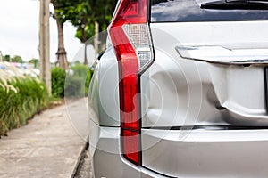 A car has a dented rear bumper after an accident,Backside of new photo