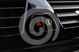 Car hazard warning flashers and emergency button with visible red triangle. Selective focus. Automotive part concept. Emergency st