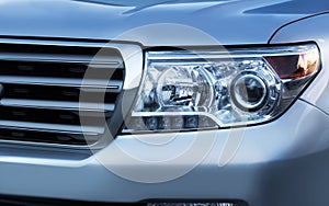 Car headlight & grille photo.