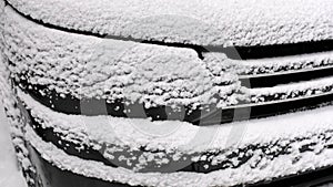 car headlight in the snow. frozen car