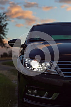 Car headlights lit at night, headlights at night