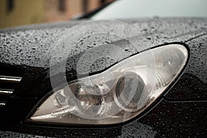 Car headlights with rain drops.