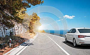 Car on the highway along the sea coast.