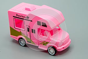 car.home. vehicle.elegent luxyry rv. caravan, pink colour moterhome on a gray background.
