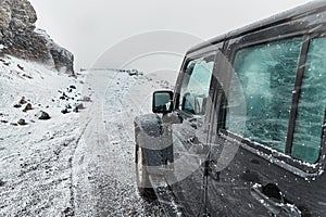 Car on Icelandic snowy terrain