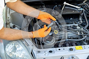 Car ignition or spark coil replacement. Repairing of vehicle.
