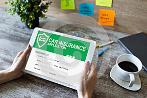 Car insurance application form on screen. Internet and business concept.