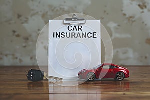 Car insurance form, key, toy car for protection, readiness, and security. photo