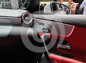 Car interior, a close up view of leather car door panel photo