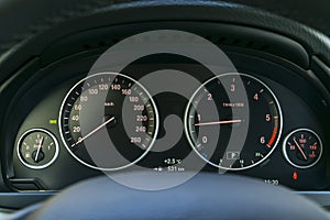 Car interior dashboard details with indication lamps. Car detailing. Car instrument panel. Dashboard closeup with visible