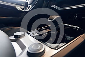 Car interior. Modern car illuminated dashboard. Luxurious car instrument cluster. Close up shot of automobile instrument panel