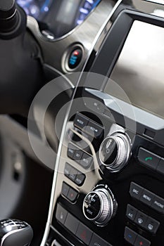 Car interior. Modern car illuminated dashboard. Luxurious car instrument cluster. Close up shot of car instrument panel