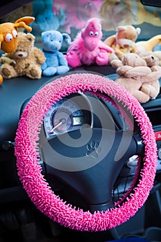 Car interior, with pink details.