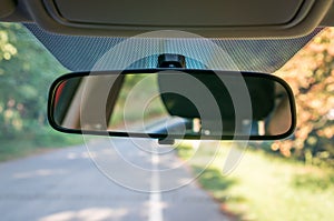 Car interior with rear view mirror and windshield photo