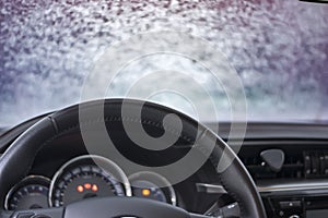 Car Interior with snow-covered windshield