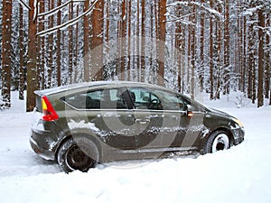 Car jammed in snowdrifts photo