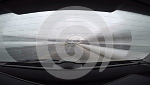 Car journey time lapse, rear view with blurred motion