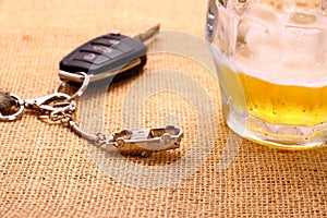 Car key with accident and beer mug