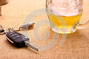 Car key with accident and beer mug