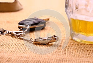 Car key with accident and beer mug
