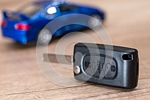 car key and blue car toy